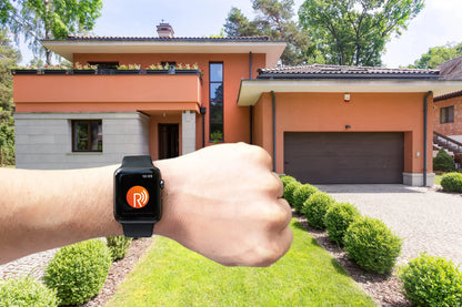 Smartwatch controlling automated garage gate at modern home, featuring Italian gate automation tech for Qatar residences.