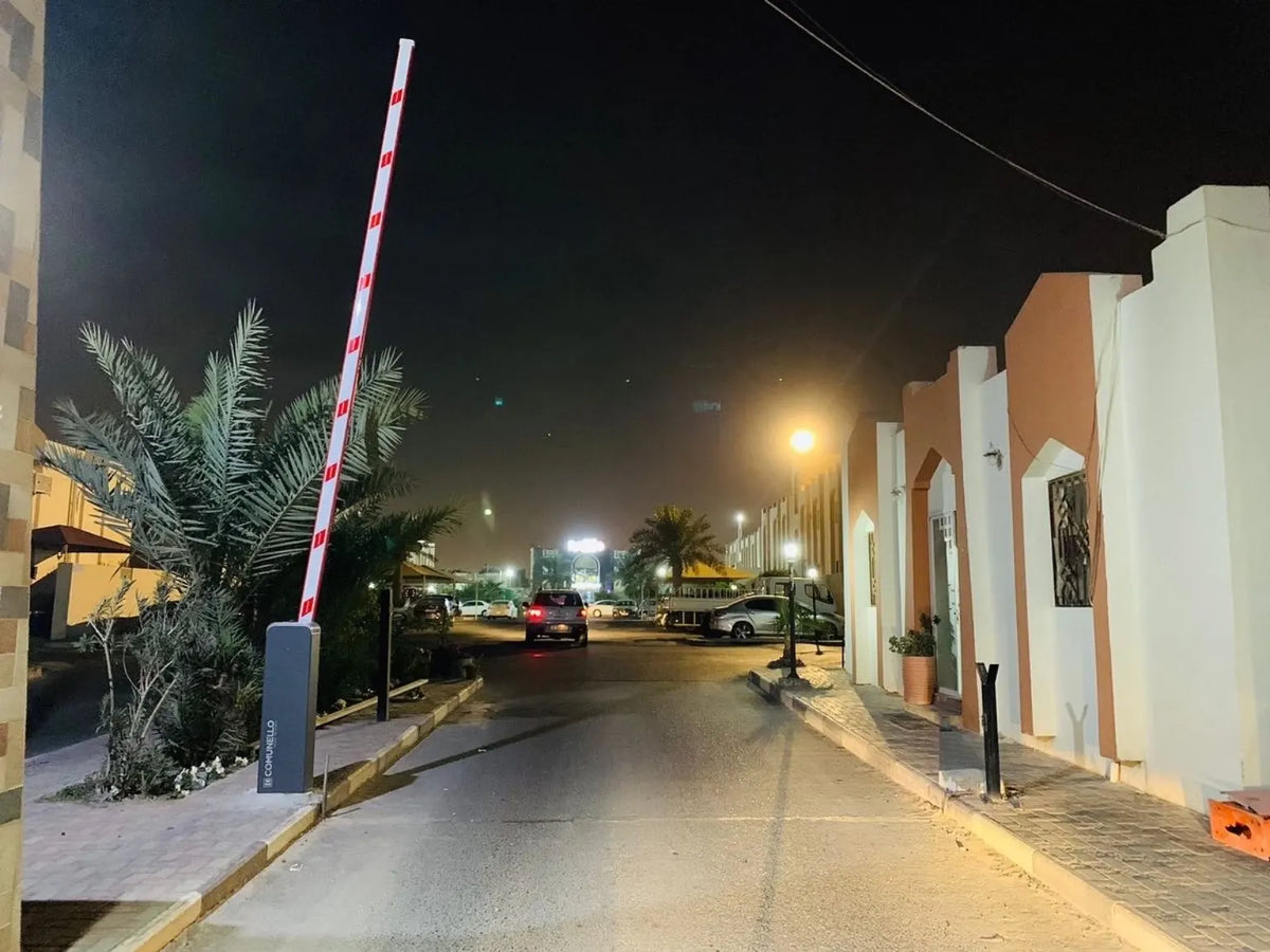 Comunello automatic barrier installation operating at night in Qatar